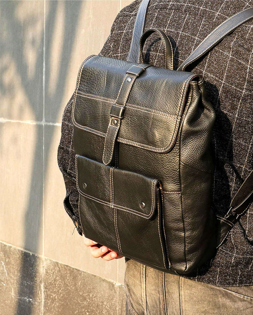 Black leather backpack with space for a 15.6-inch laptop.