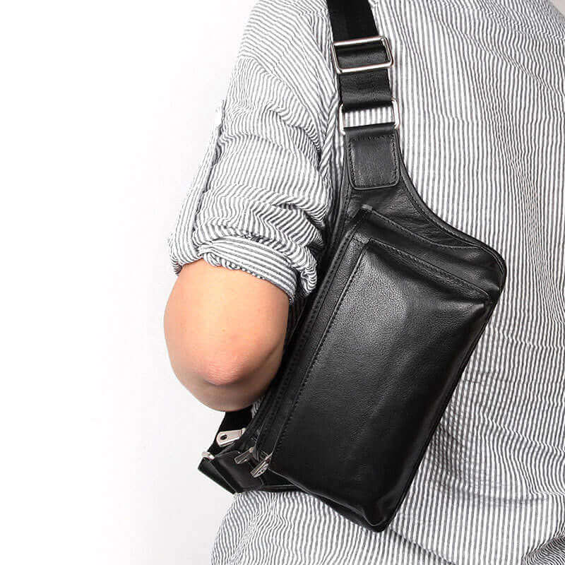 Multi-functional black leather waist bag for on-the-go convenience.