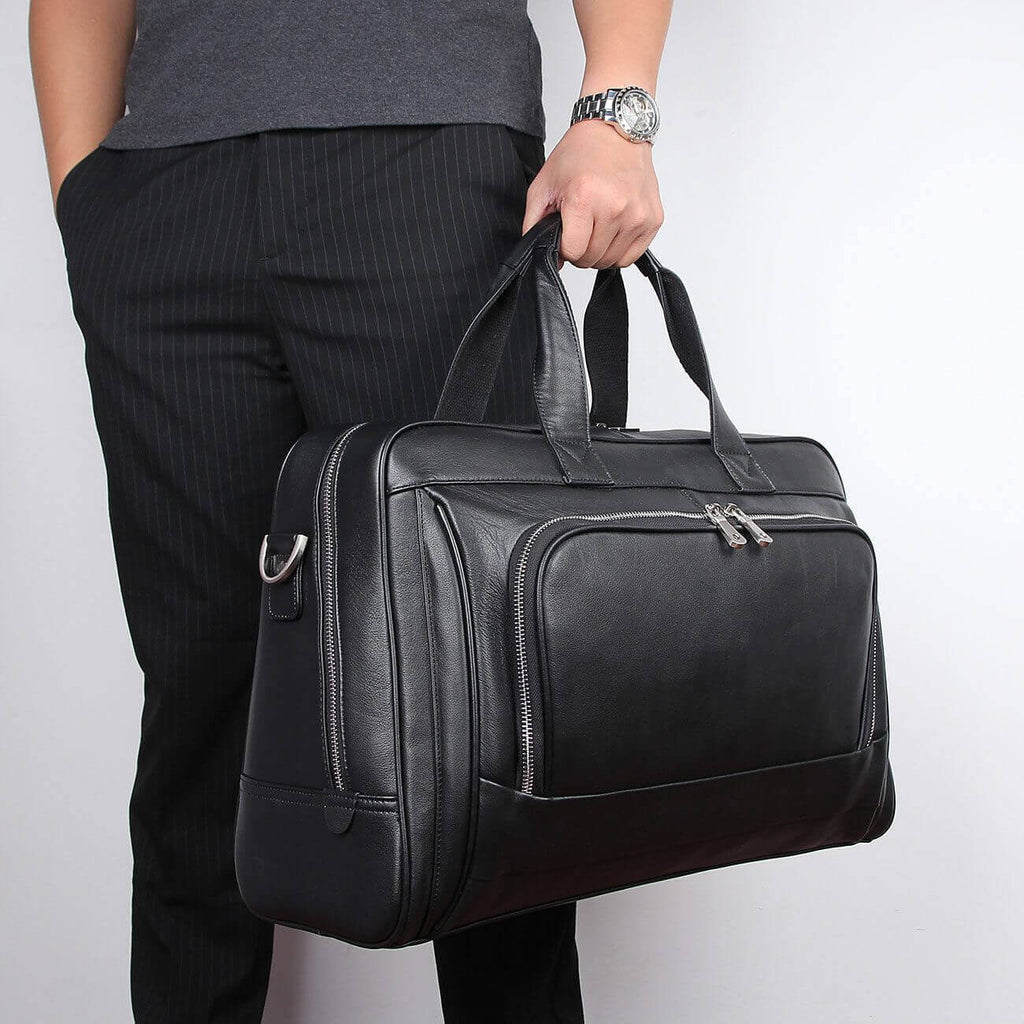 Spacious business leather laptop bag with compartments for essentials.