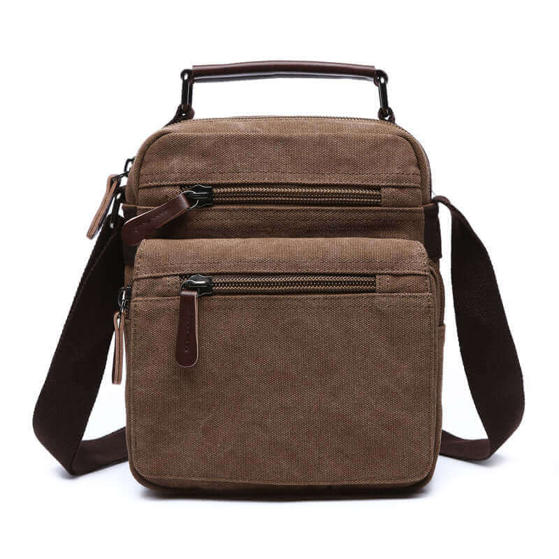 Coffee canvas crossbody bag with leather accents and multiple zippered compartments.