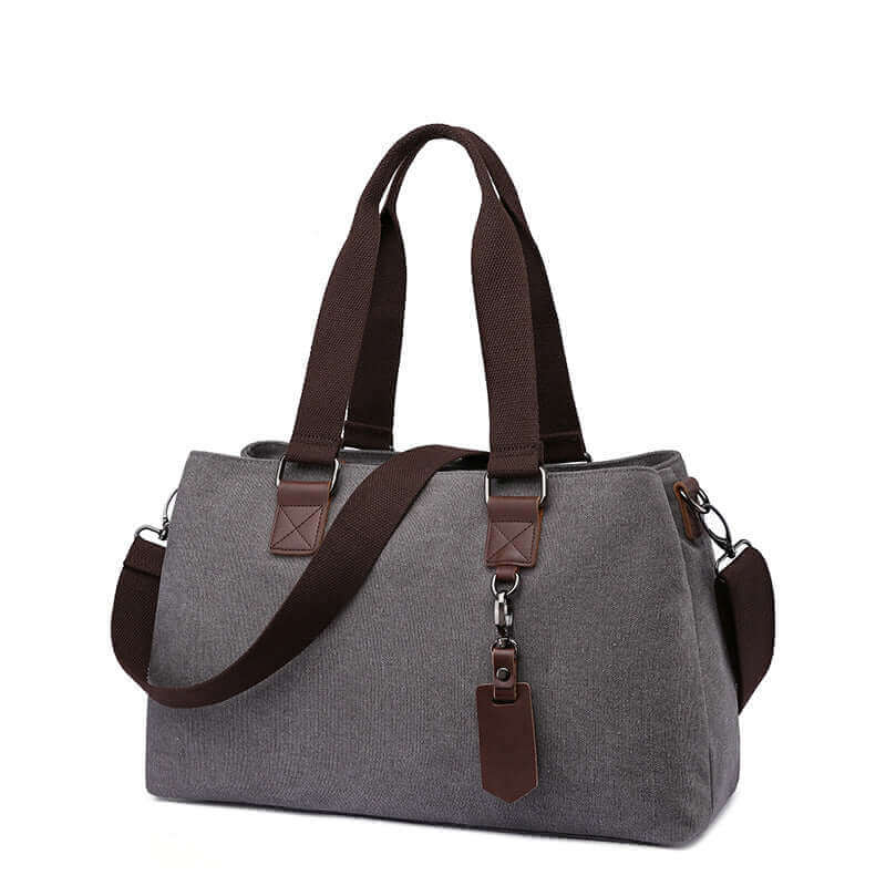 Canvas tote bag for women with three zippered compartments, offering ample storage space.