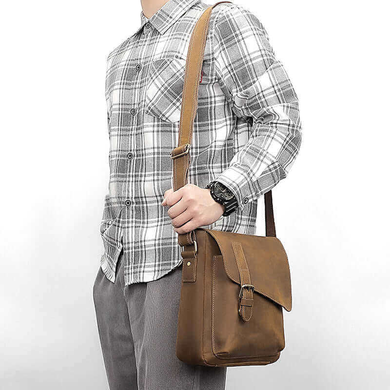 Vintage genuine leather crossbody bag with buckle flap.