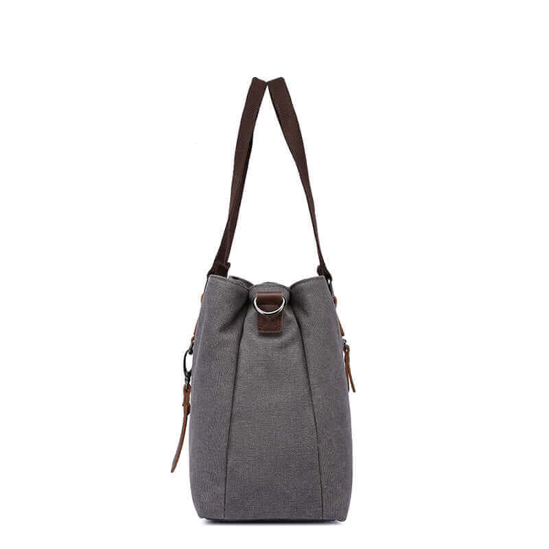 Side view of the grey canvas tote bag.