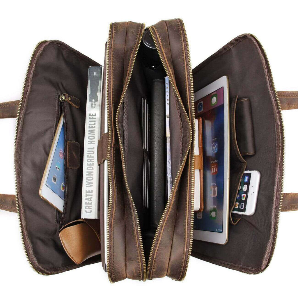 Spacious storage compartments inside a men's leather laptop bag.