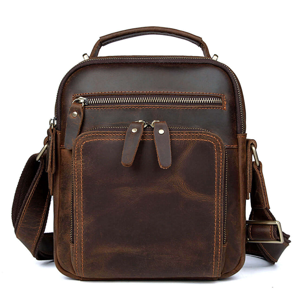 Front view of a men’s leather crossbody bag with adjustable strap.