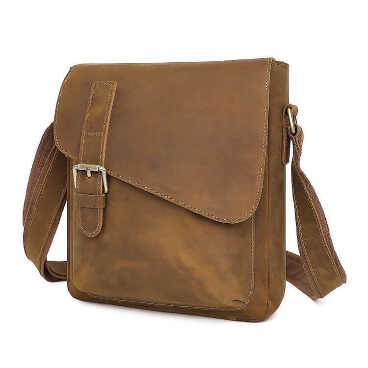 Versatile leather crossbody bag with zippered main compartment.