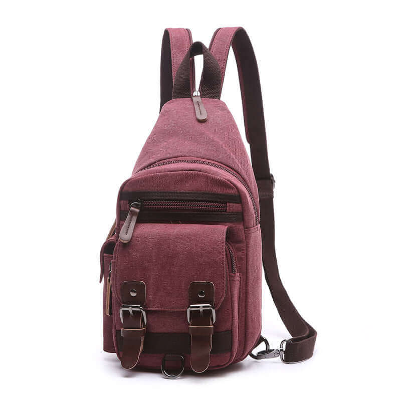 Women's canvas sling bag, designed for casual use with multiple zippered compartments.