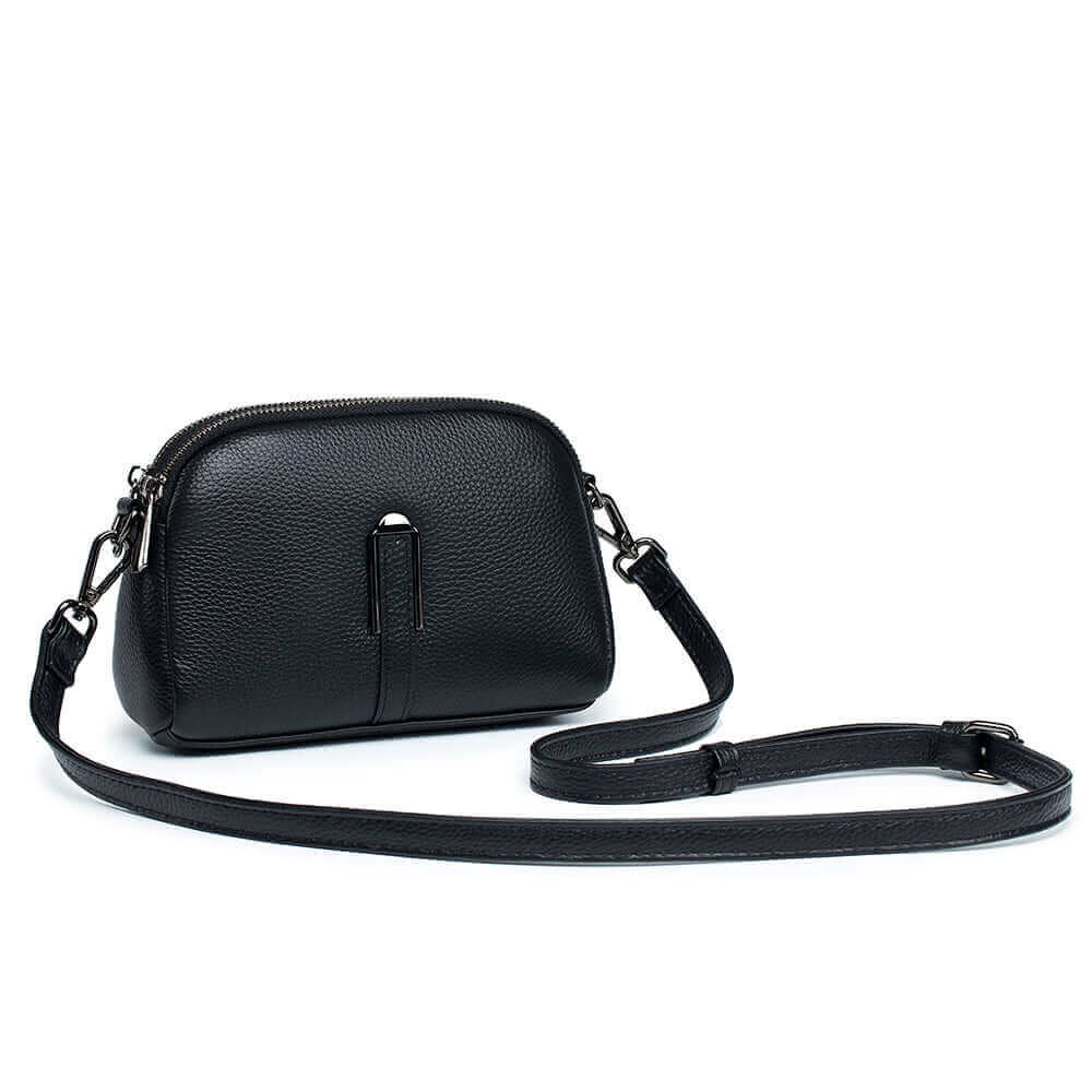 Women's leather shoulder bag with double zipper and sleek fashionable style.