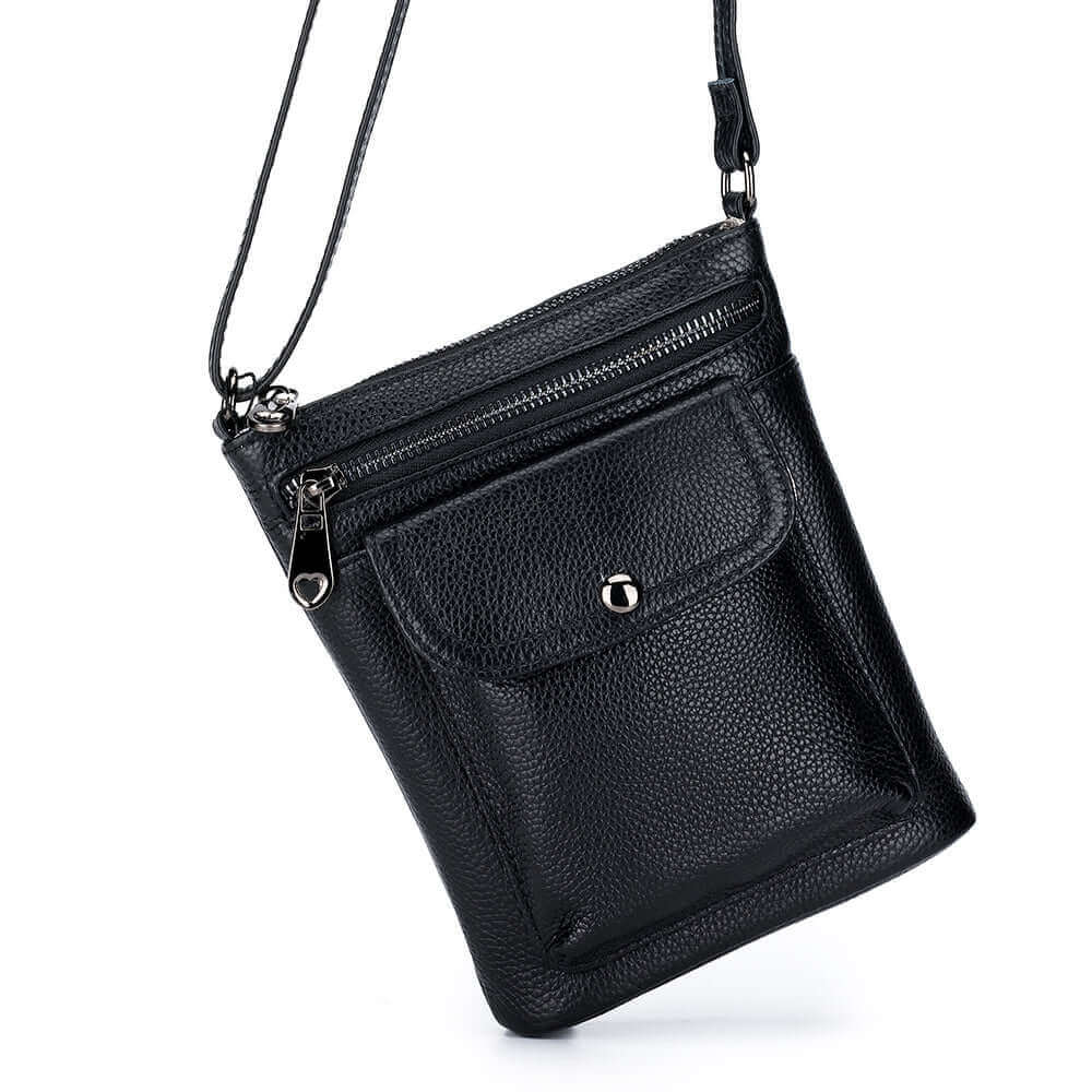 Women's genuine leather small crossbody bag with front pocket and zipper compartment.