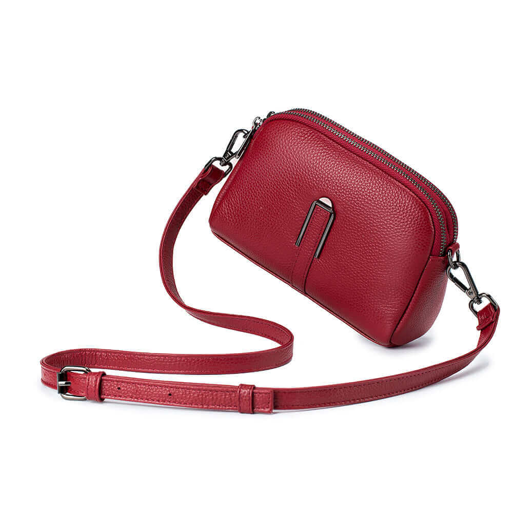 Women's genuine leather double zipper crossbody bag in red with multiple compartments.