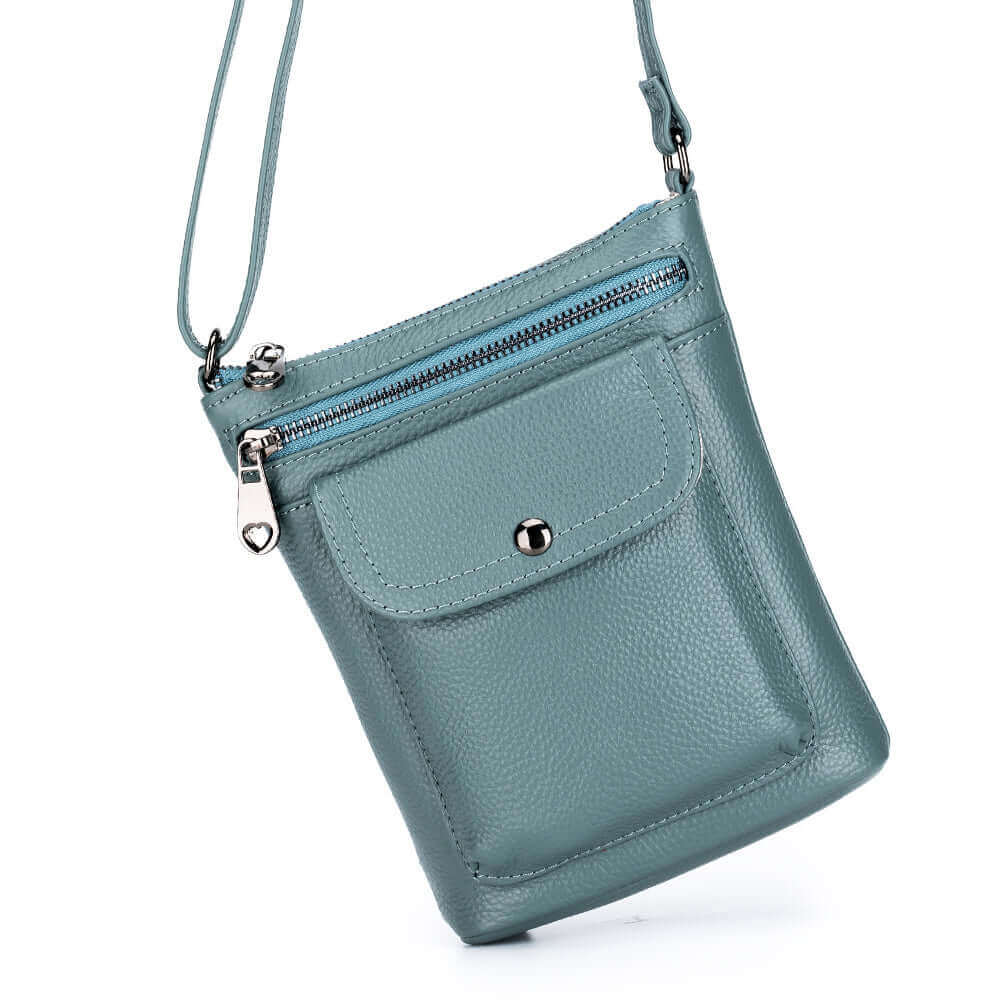 Women's small leather crossbody bag in black, perfect for carrying essentials.